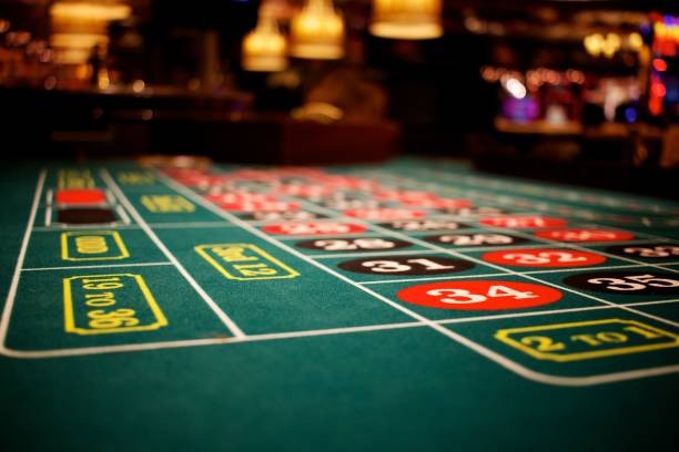 Live baccarat table broadcast showing dealer, card layout, and player betting area